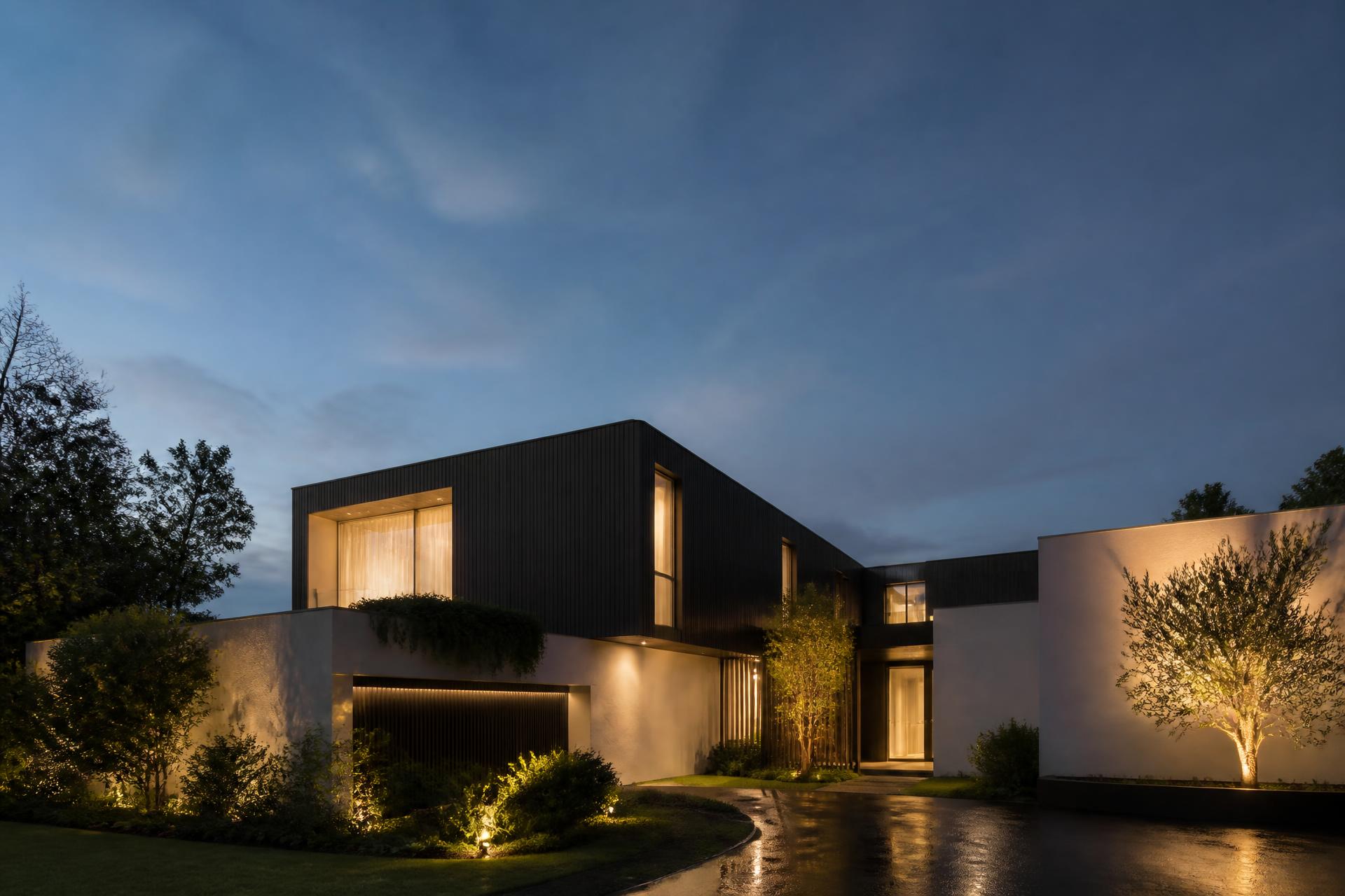 Modern Adelaide luxury home lit at dusk